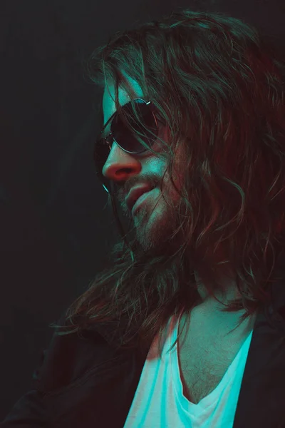 Long haired caucasian man in sunglasses — Stock Photo