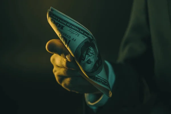 Man holding us dollar banknotes — Stock Photo