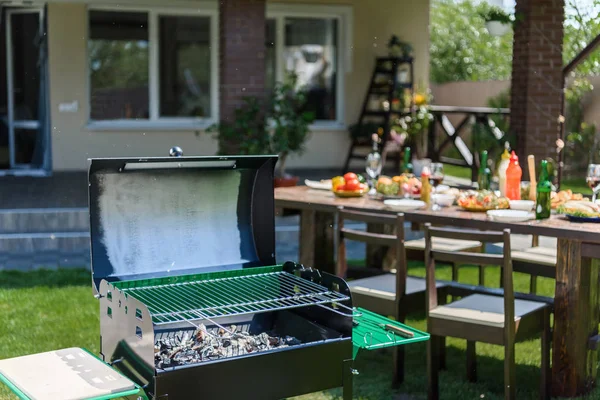 Grill on green lawn — Stock Photo