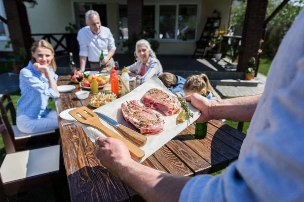 Happy family at barbecue — Stock Photo