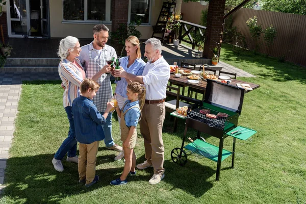 Happy family at barbecue — Stock Photo