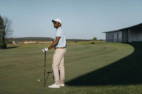 African american man playing golf — Stock Photo