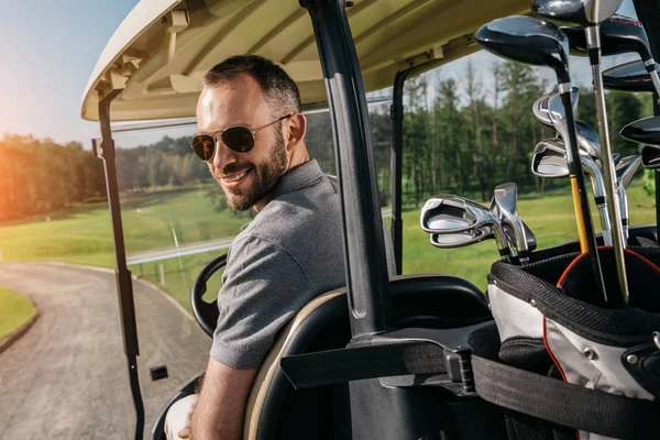 Golf player spend time at golf course — Stock Photo