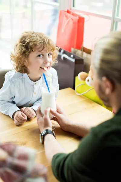 Boy drinking milkshake — Stock Photo