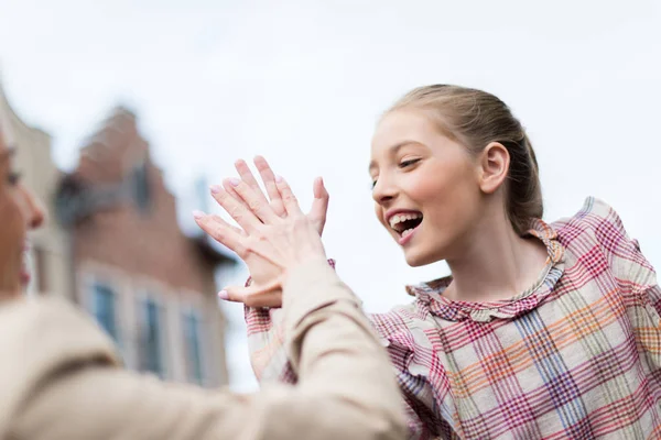 Daughter giving high five to mother — Stock Photo