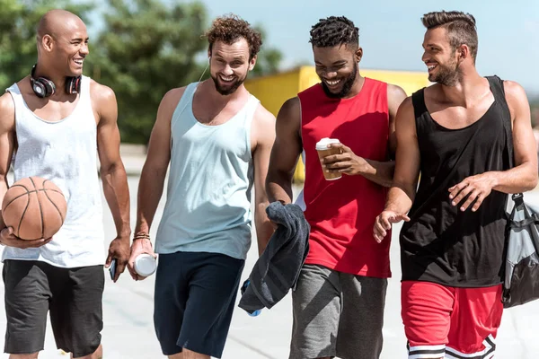 Multiethnic sportsmen on court — Stock Photo