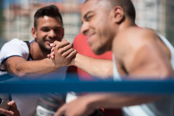 Multicultural men on stadium — Stock Photo