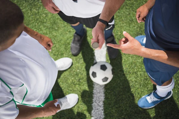 Referee and soccer players — Stock Photo