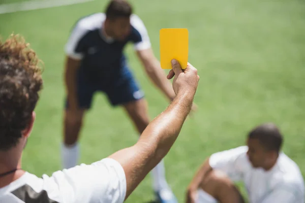 Referee showing yellow card — Stock Photo