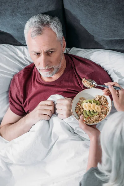 Woman taking care of husband — Stock Photo