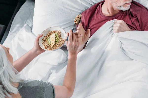 Woman taking care of husband — Stock Photo