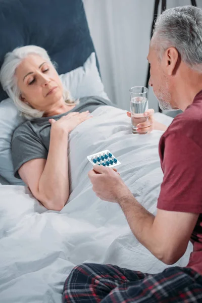 Man taking care of wife — Stock Photo