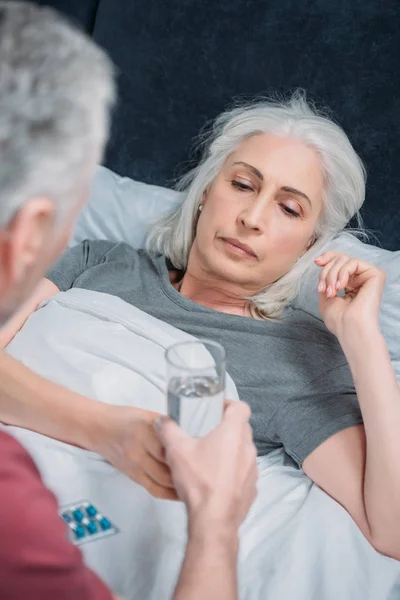 Man taking care of wife — Stock Photo