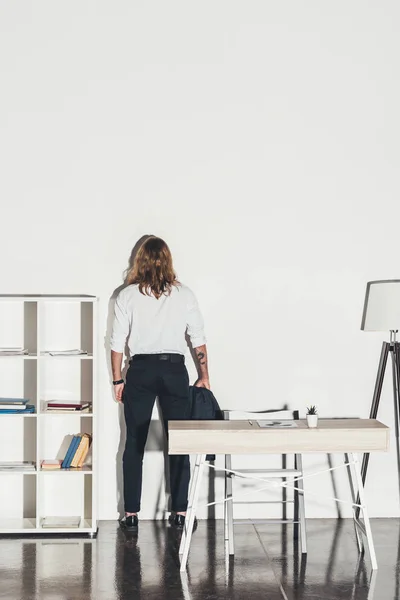 Businessman standing in office — Stock Photo