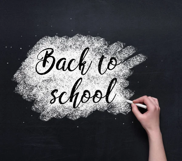 Back to school lettering on blackboard — Stock Photo