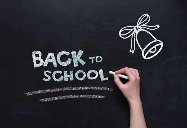 Back to school lettering on blackboard — Stock Photo