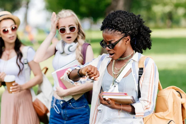 Girl checking wristwatch — Stock Photo