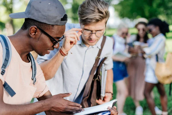 Multiethnic boys reading book — Stock Photo