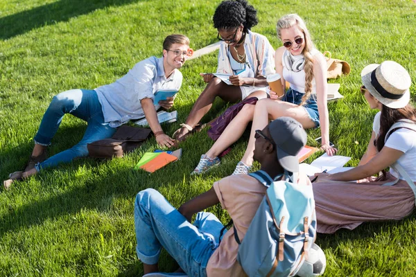 Multiethnic students resting in park — Stock Photo