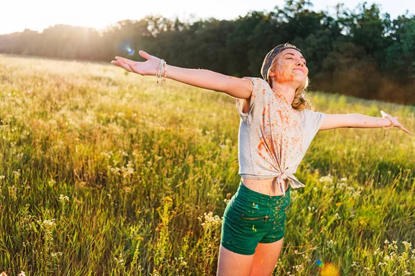 Happy girl at holi festival — Stock Photo