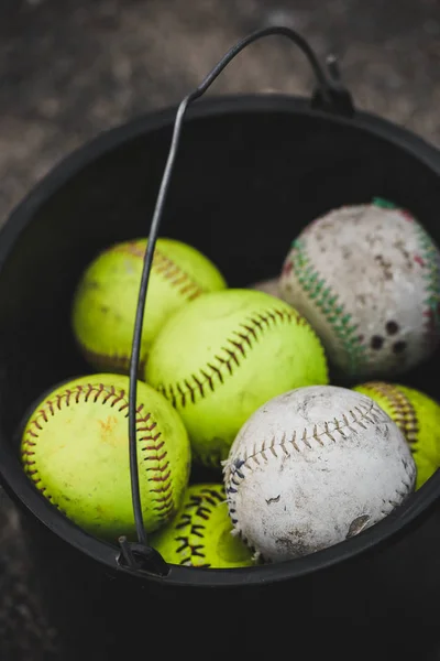 Bucket full of baseball balls — Stock Photo