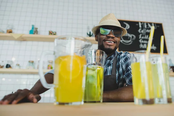 African american bartender with lemonades — Stock Photo