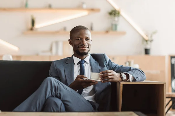 Handsome businessman in coffee shop — Stock Photo