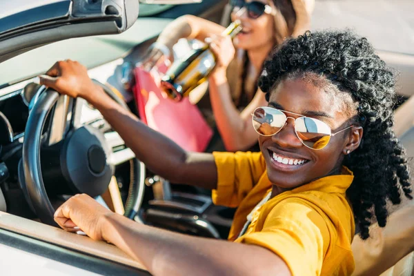 African american woman riding car — Stock Photo