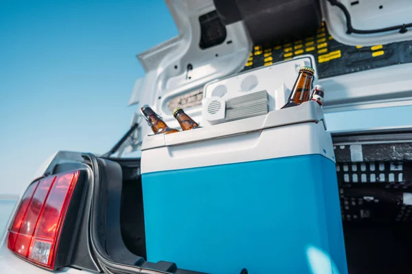 Portable fridge with beer in car — Stock Photo