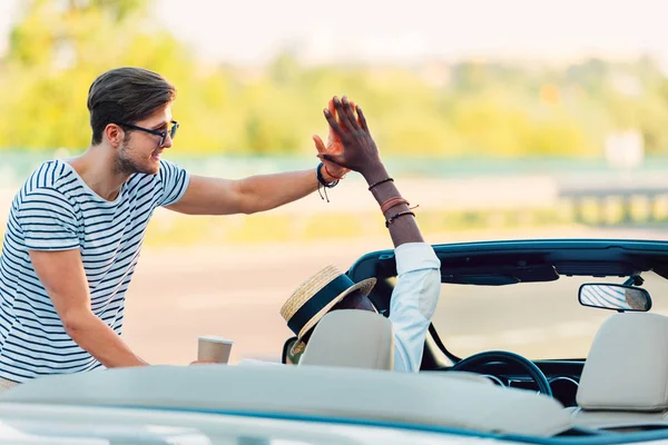 Multicultural men giving high five — Stock Photo