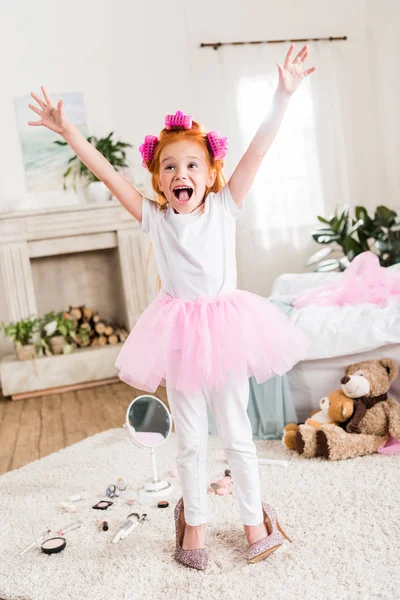 Excited little girl in high heels — Stock Photo