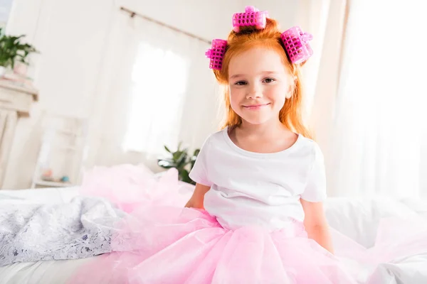 Little girl with curlers and tutu tulle skirt — Stock Photo