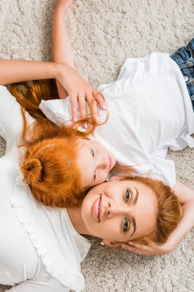 Smiling mother and little daughter — Stock Photo