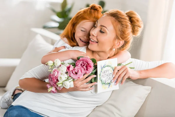 Girl greeting mother on mothers day — Stock Photo