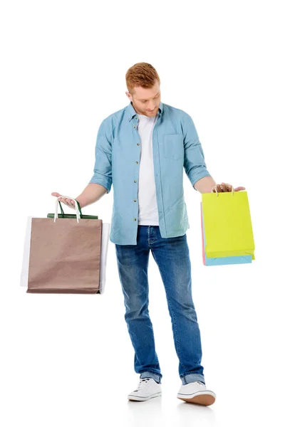 Hombre joven con bolsas de compras - foto de stock