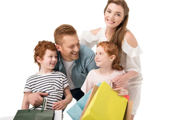 Familia feliz con bolsas de compras - foto de stock