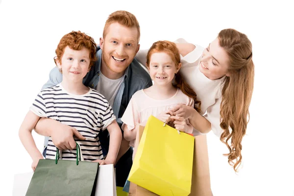 Familia feliz con bolsas de compras - foto de stock