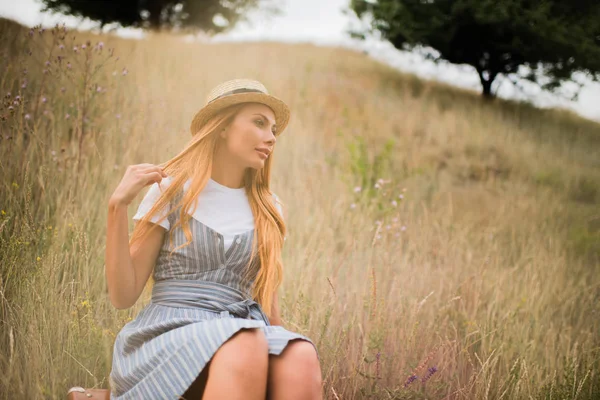 Young woman on grassland — Stock Photo