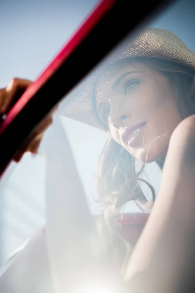 Woman behing car window — Stock Photo