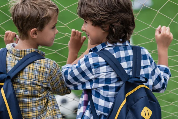 Schoolboys on soccer field — Stock Photo