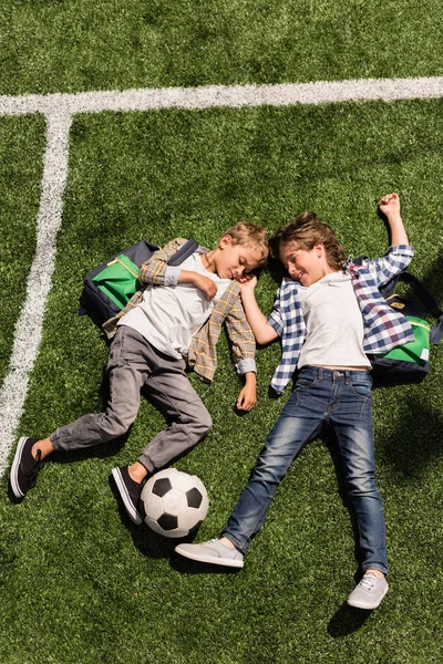 Schoolboys with soccer ball — Stock Photo