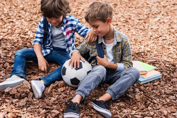 Schoolboys with soccer ball — Stock Photo