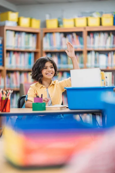 Girl raising hand on lesson — Stock Photo