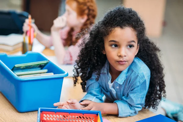 Girl with box of books — Stock Photo