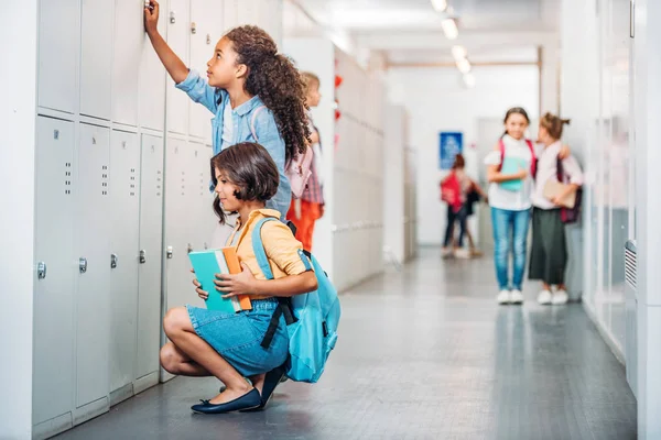 Kids in school corridor — Stock Photo