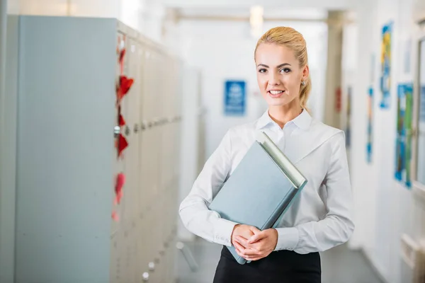 Young teacher with books — Stock Photo