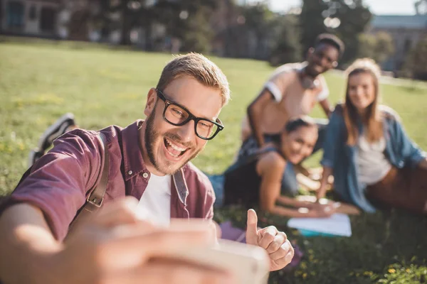 Multicultural friends taking selfie — Stock Photo