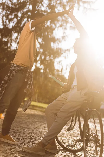 Students making high five — Stock Photo