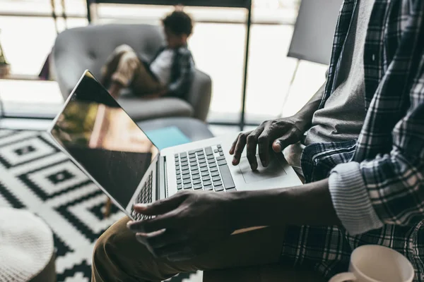 Father and son using gadgets — Stock Photo