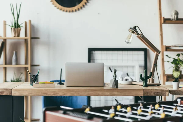 Laptop in modern office — Stock Photo